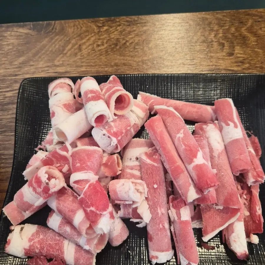 Plate of vegetables and meat gathered from the self-bar