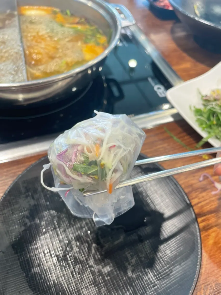 A bite of wolnamssam wrapped with only vegetables