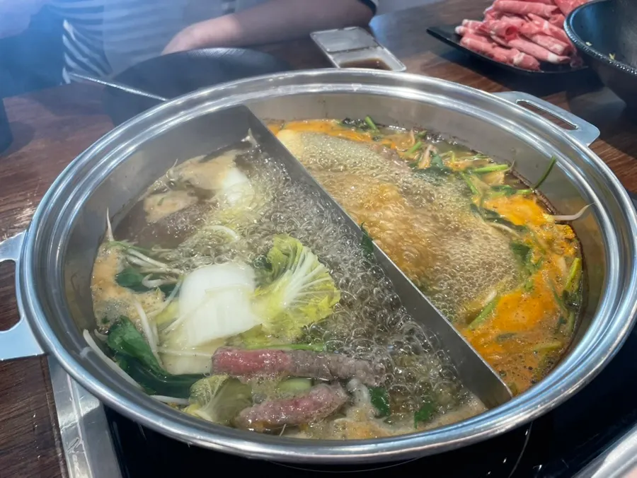 Beef added into the boiling broth