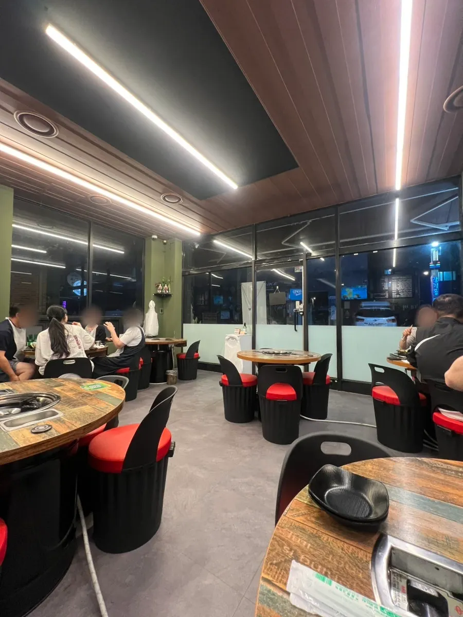 Clean, comfortable dining hall seating at Daebak Hwangso Gopchang