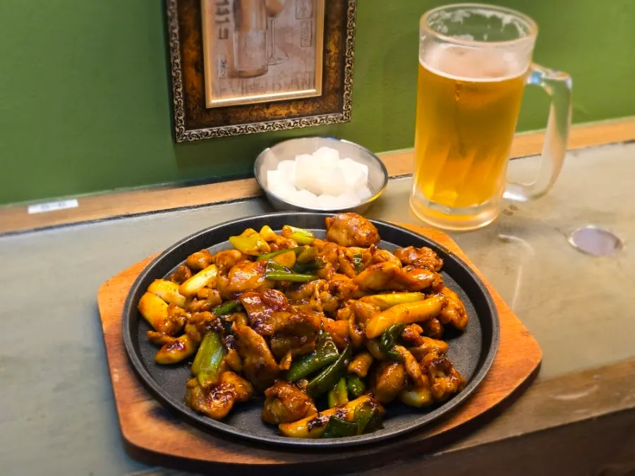 A full plate of spicy red grilled chicken