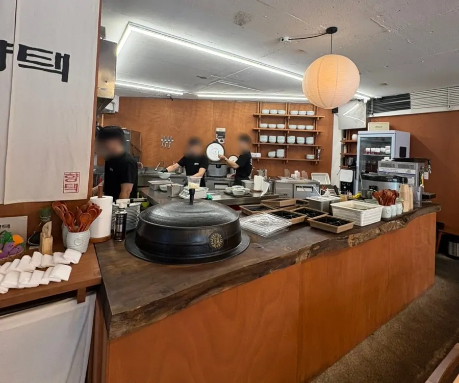 Korean restaurant interior in wood and white tones