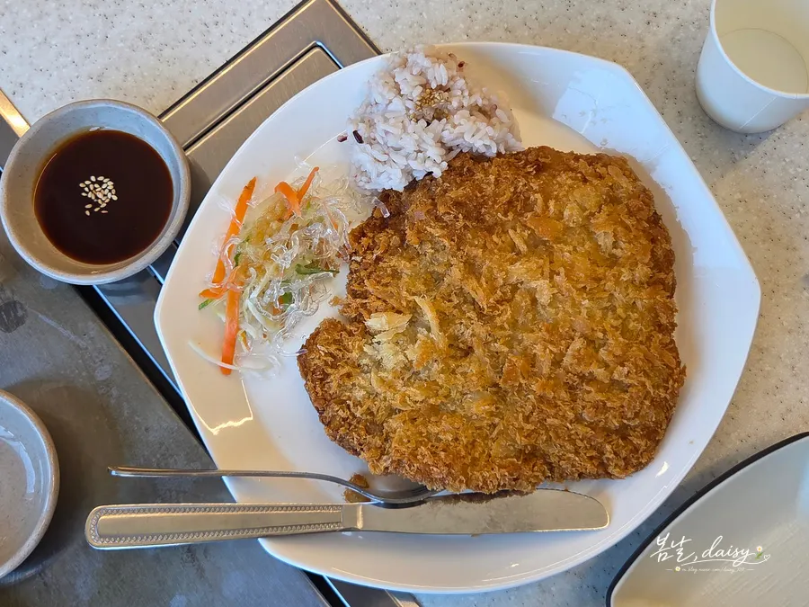 Handmade pork cutlet plated with rice and angel hair salad