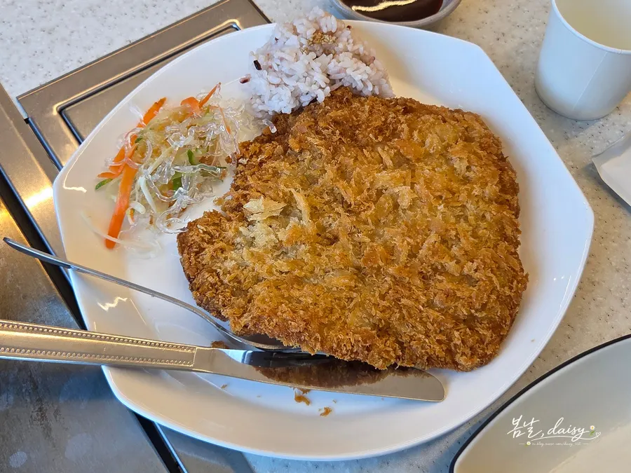 Handmade pork cutlet with sauce served on the side