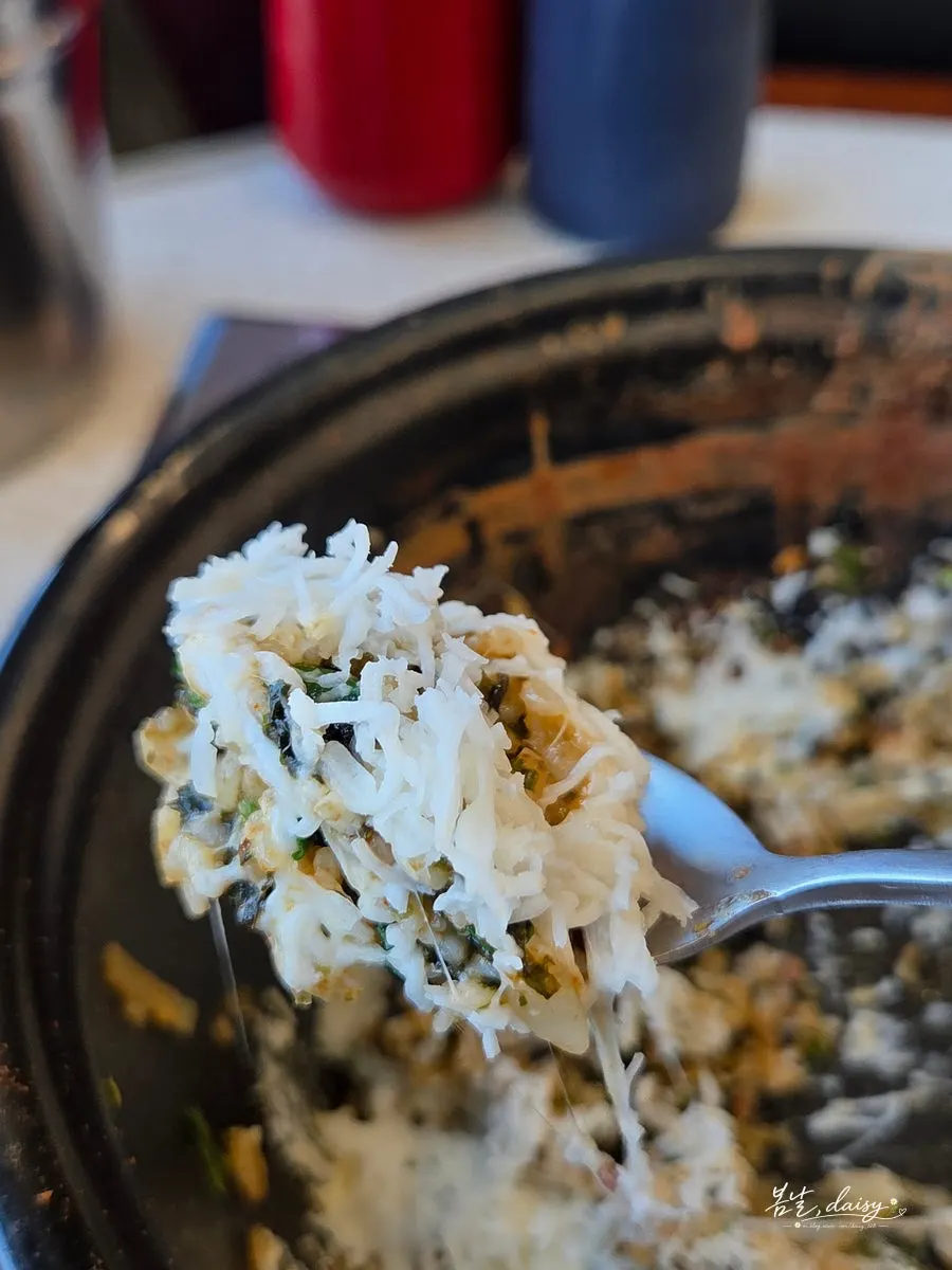 Close-up of fried rice piled high with snow cheese