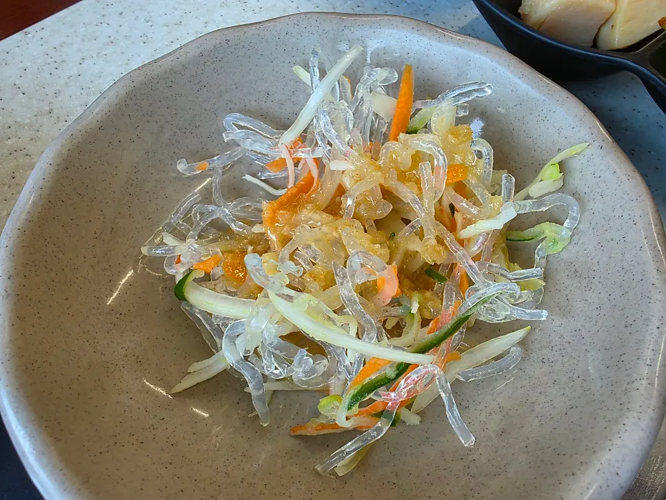 Mushrooms and broth served in a small side dish