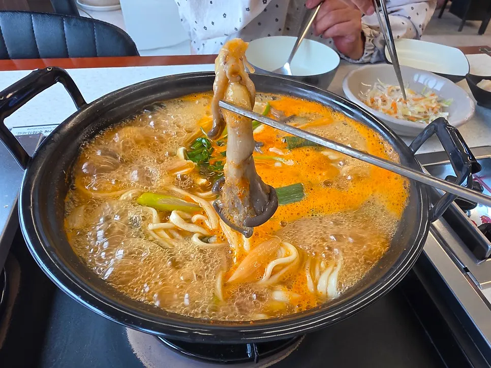 Nearly empty pot of mushroom kalguksu