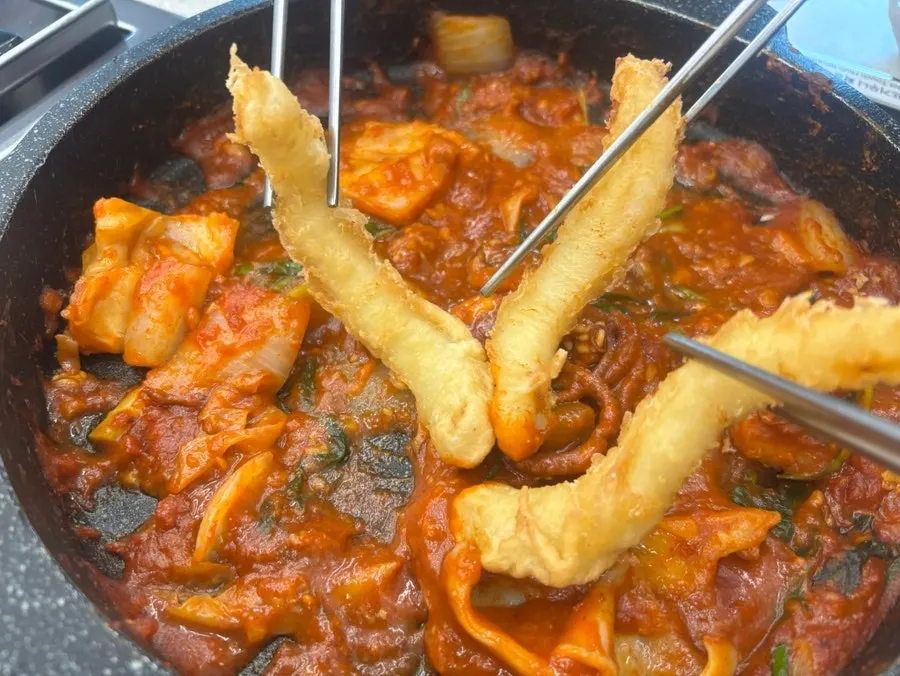 Fried squid dipped in seafood stew sauce
