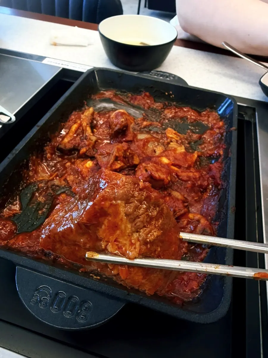 Braised ribs with onion, cabbage, and mushrooms