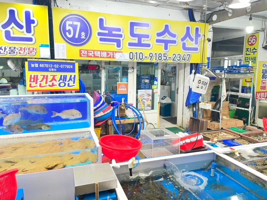 Seafood stalls lined up along the market corridor