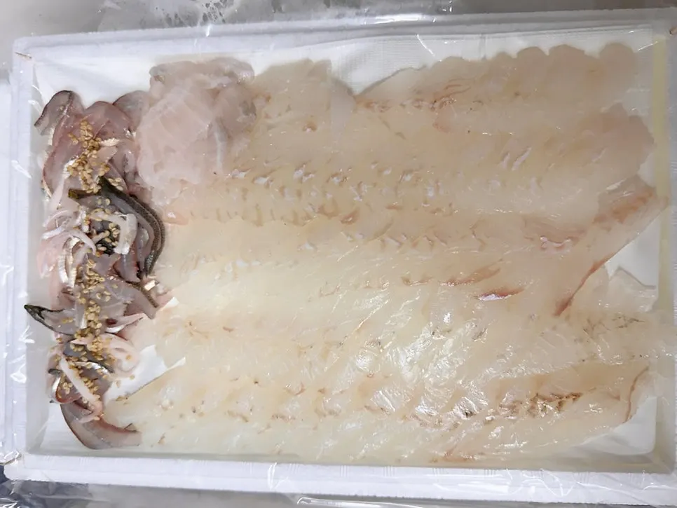 Ice box packed generously with ice for the sashimi