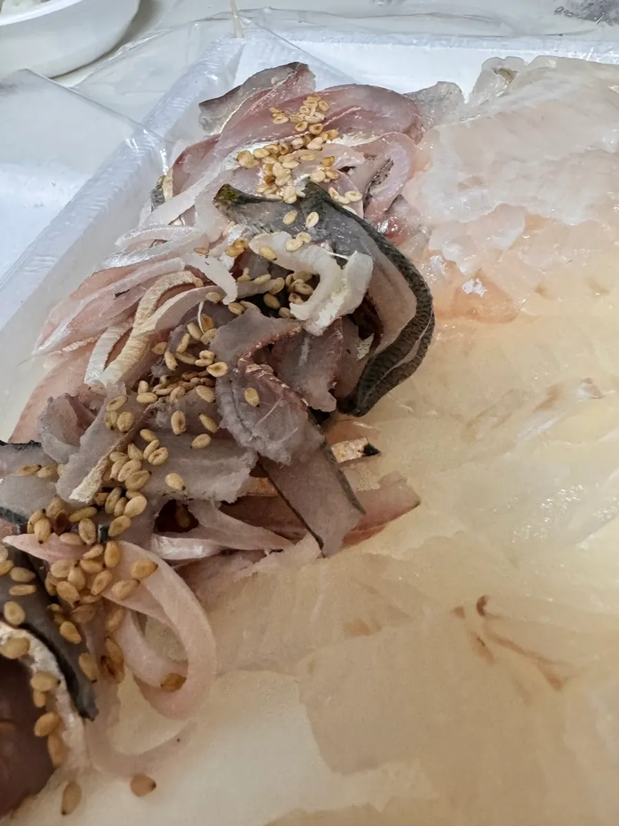Ice box opened at the lodging with sashimi still packed inside
