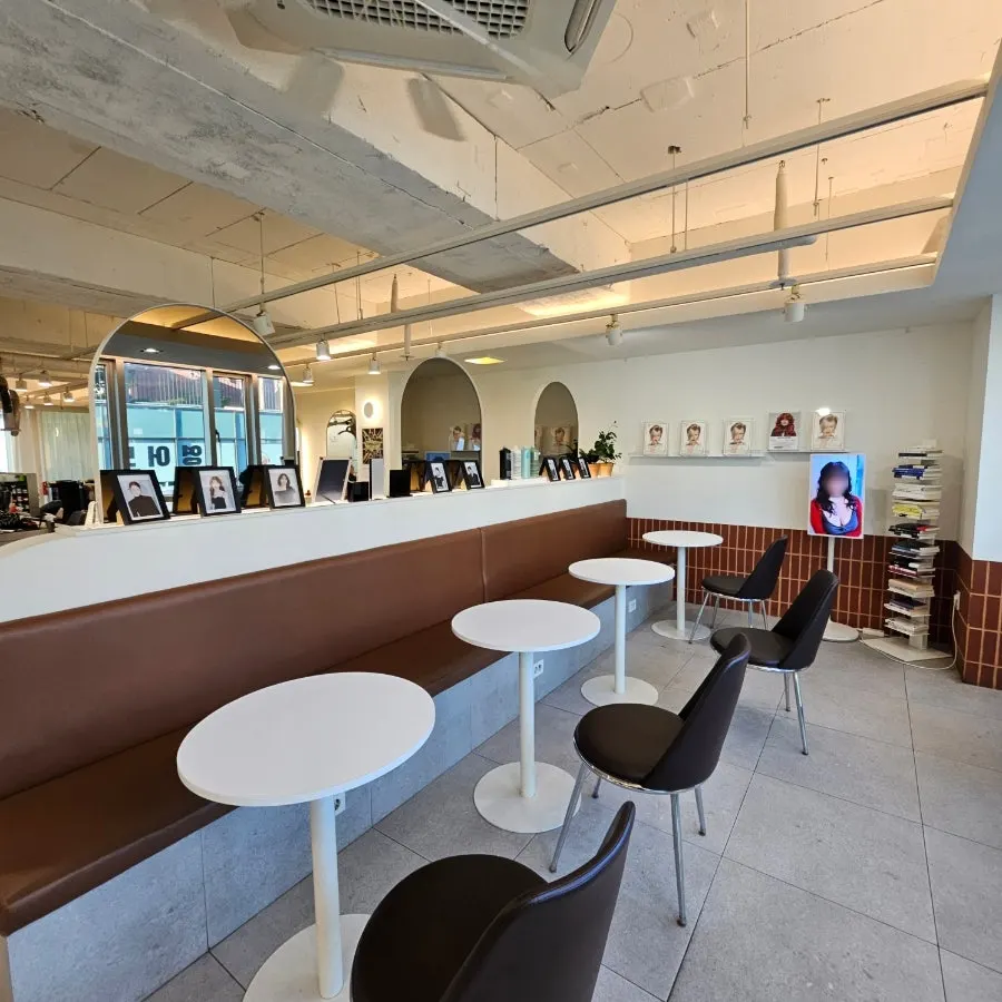 Hair salon interior in white and wood tones