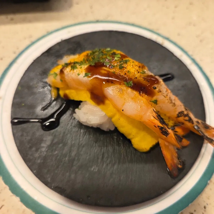 Egg shrimp sushi topped with egg and shrimp