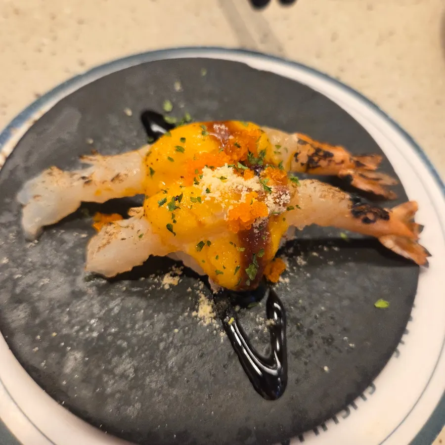 Grilled king prawn sushi topped with a large shrimp