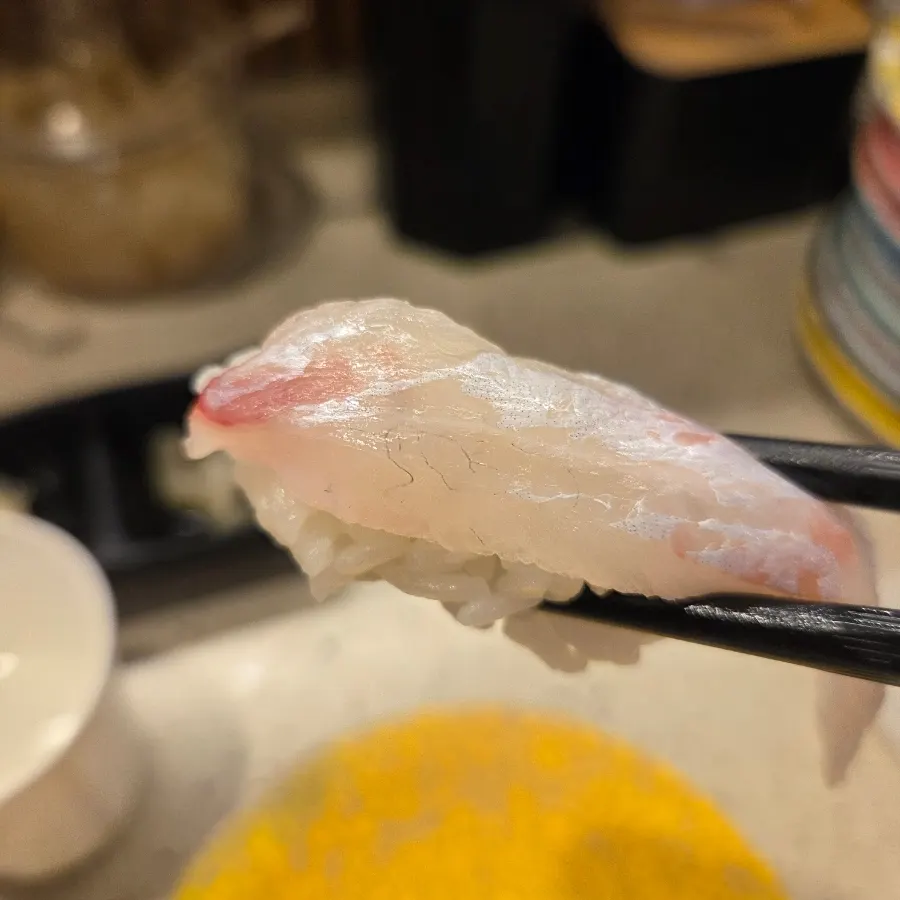 A plate of red seabream belly sushi
