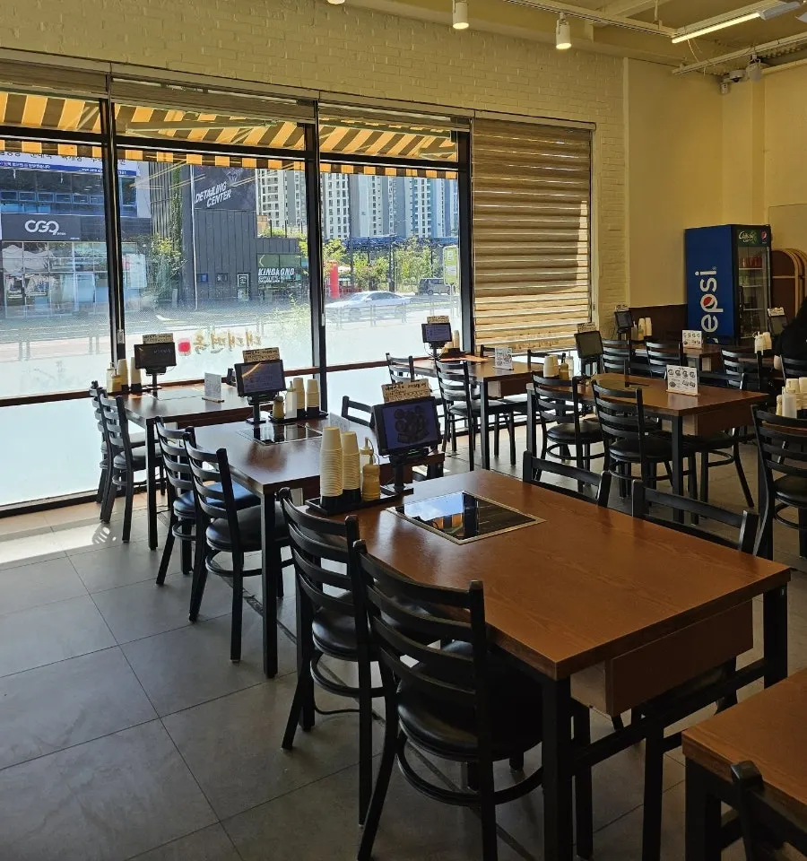 Interior of Daedae Myeonok with tables for four