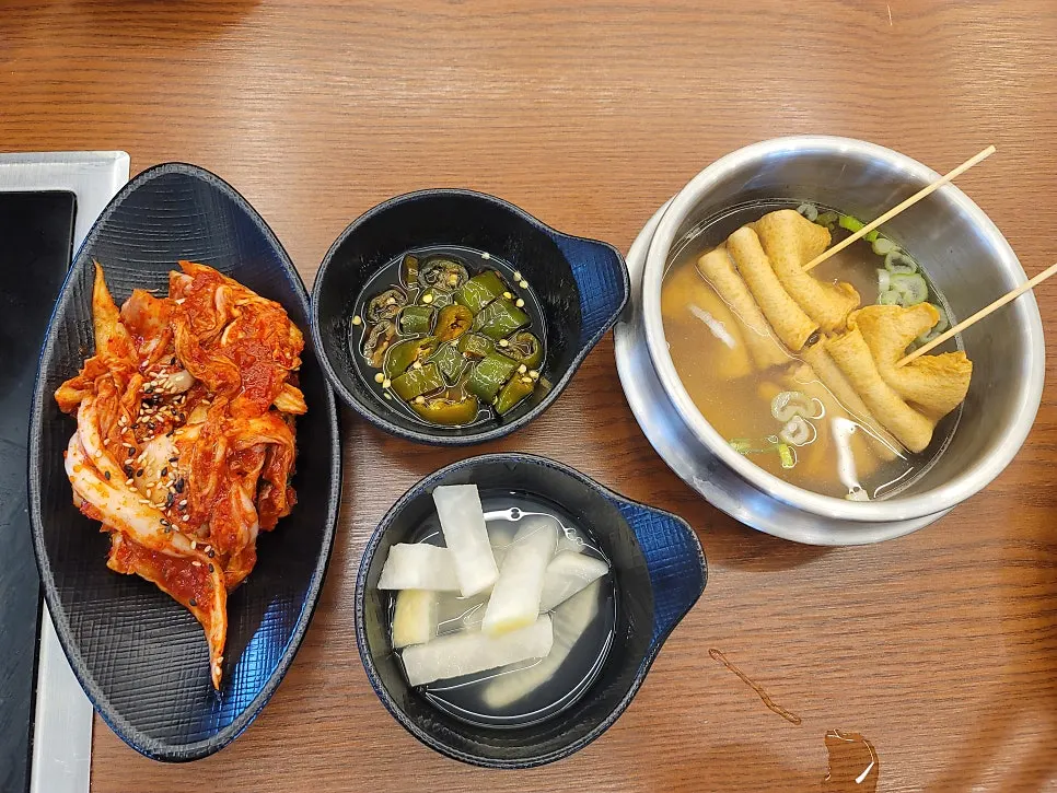 Side dishes at the self-serve bar under hygiene covers