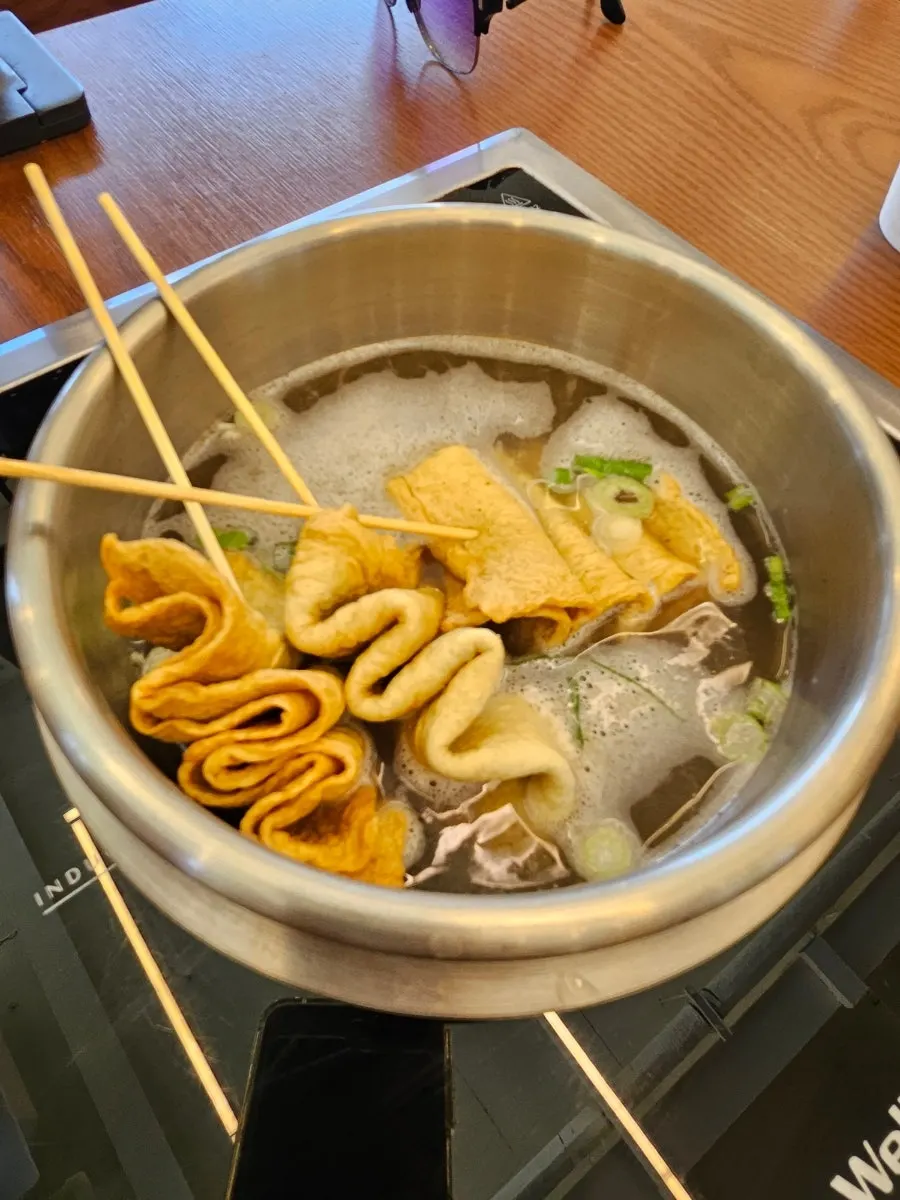 Complimentary fish cake skewer soup