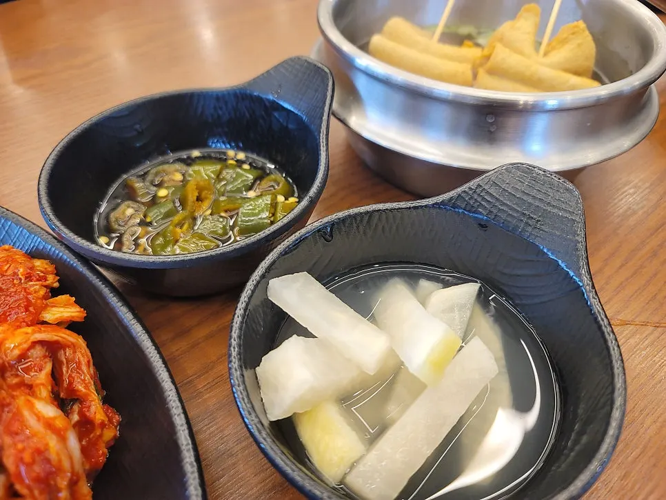 Side dish and kimchi setting at Daedae Myeonok