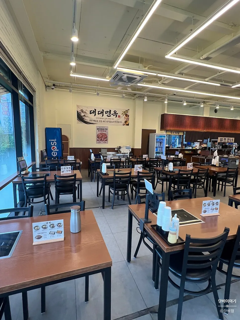Seating extending toward the back of the restaurant