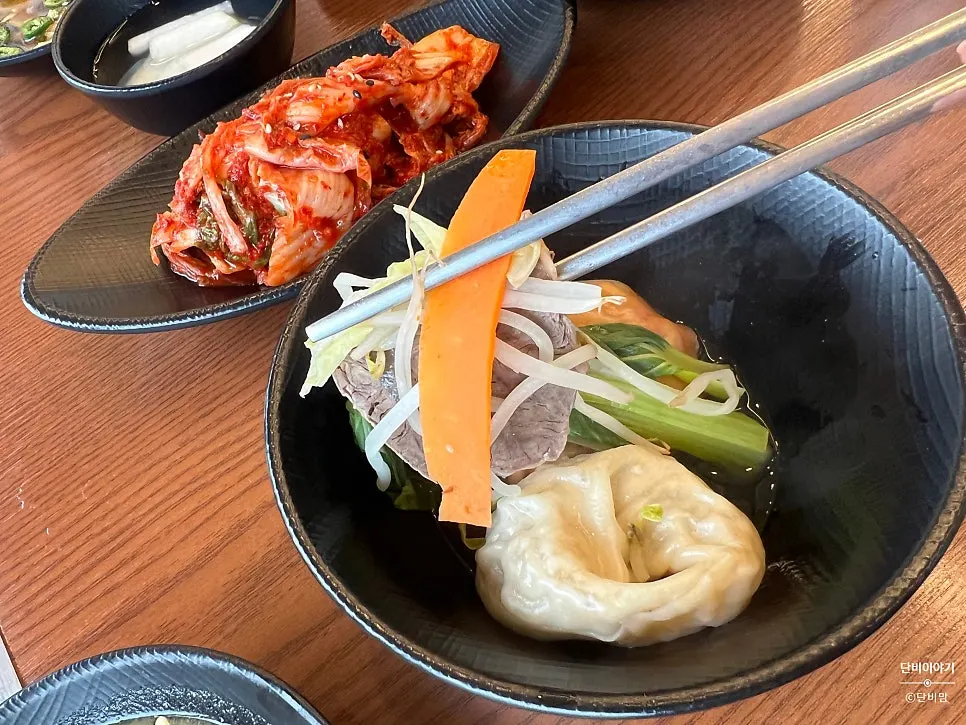A piece of aromsatae boiled beef dipped in sauce