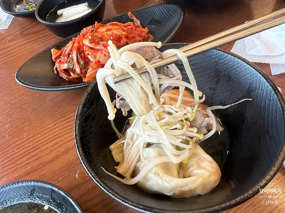 Fishing out vegetables and meat from the hot pot