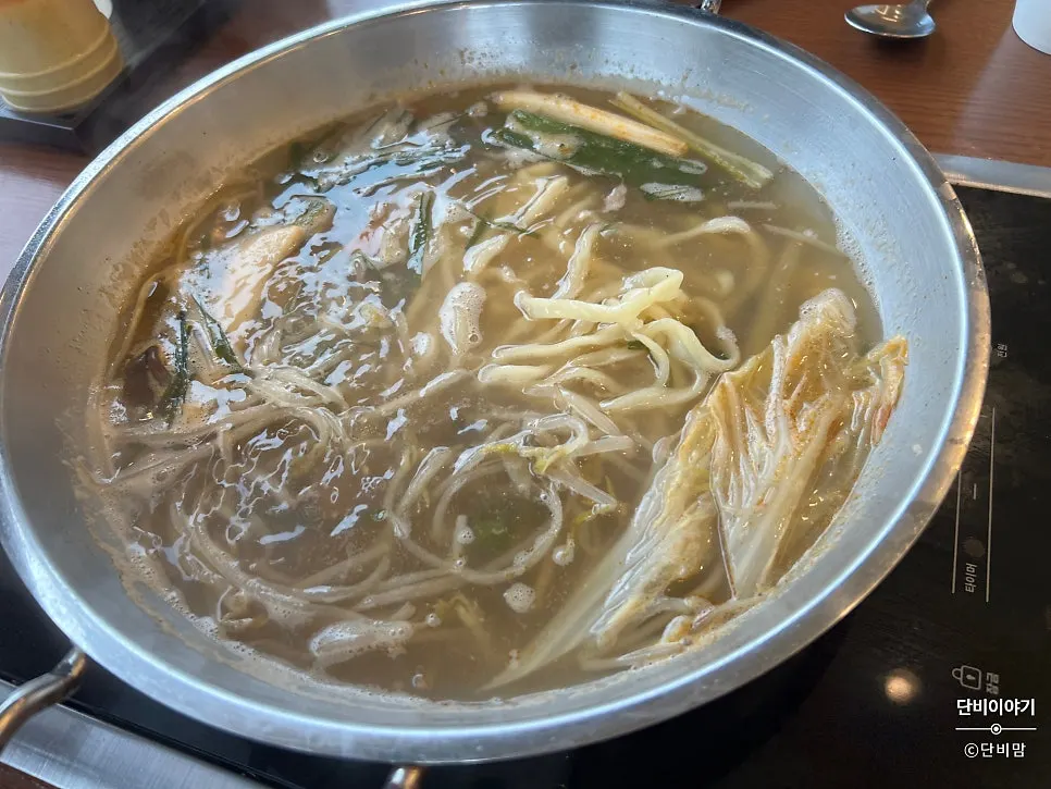A bowl of kalguksu with deepened broth flavor