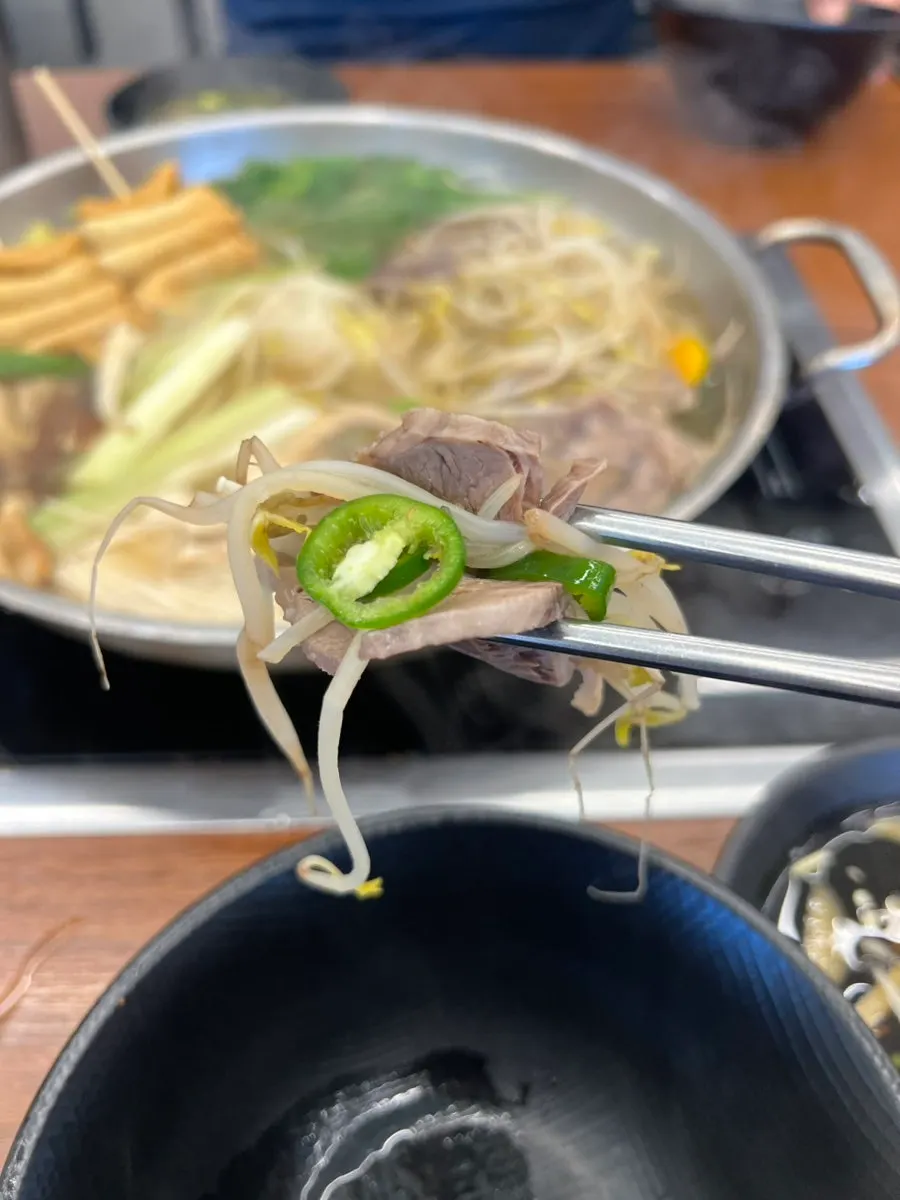 Beef shank and vegetables dipped in the special sauce