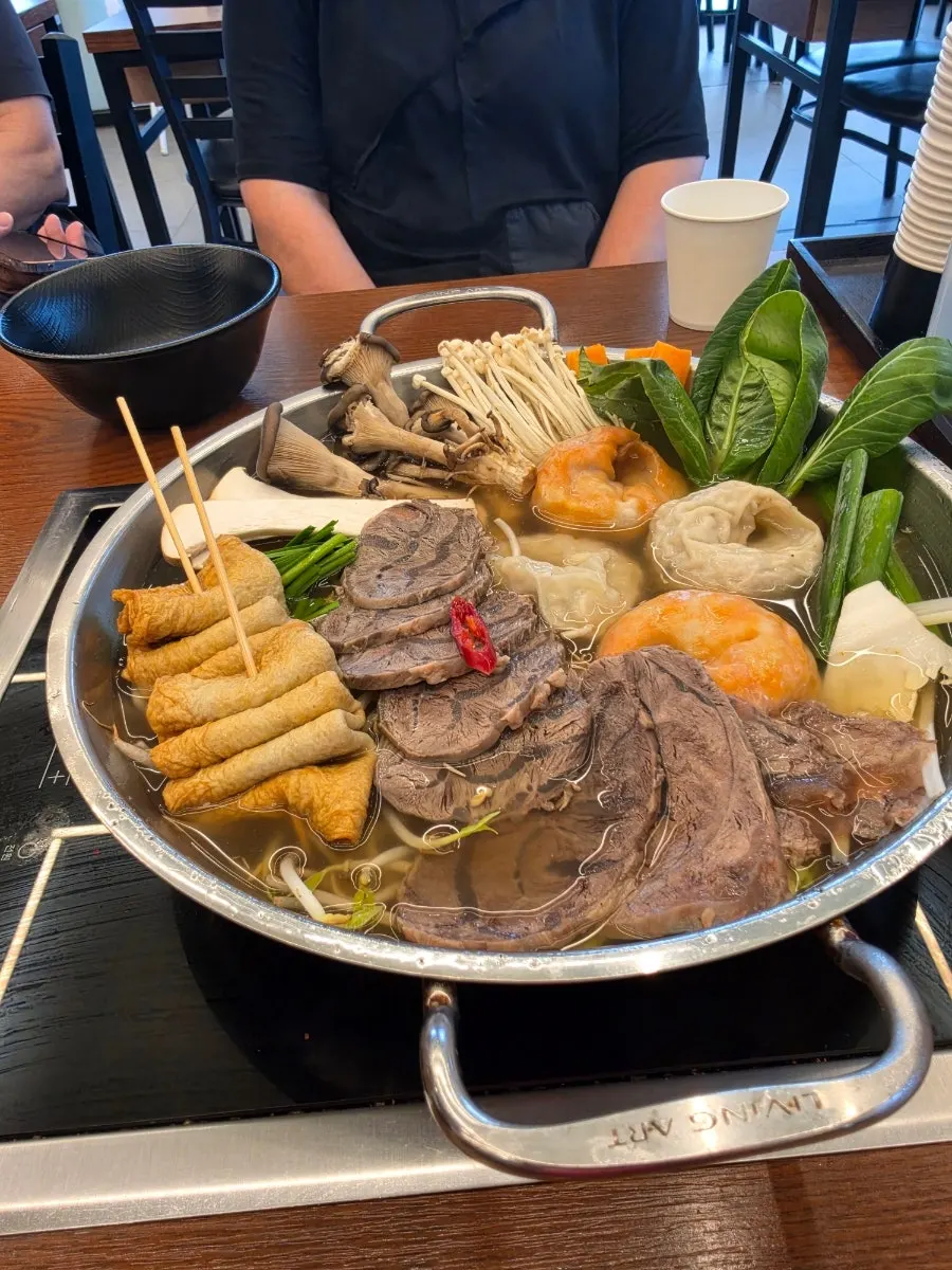 Aromsatae mandu jeongol simmering on the tabletop burner