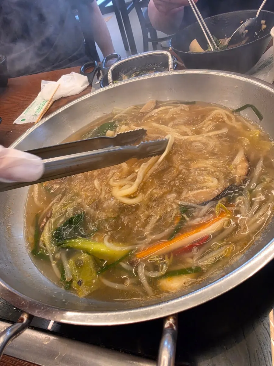 Fresh noodles added to the pot