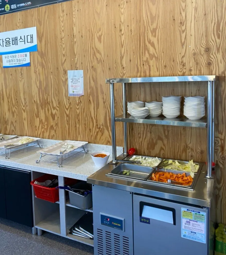 Sundubu, cucumber and chili pepper side dish, kimchi and salad counter