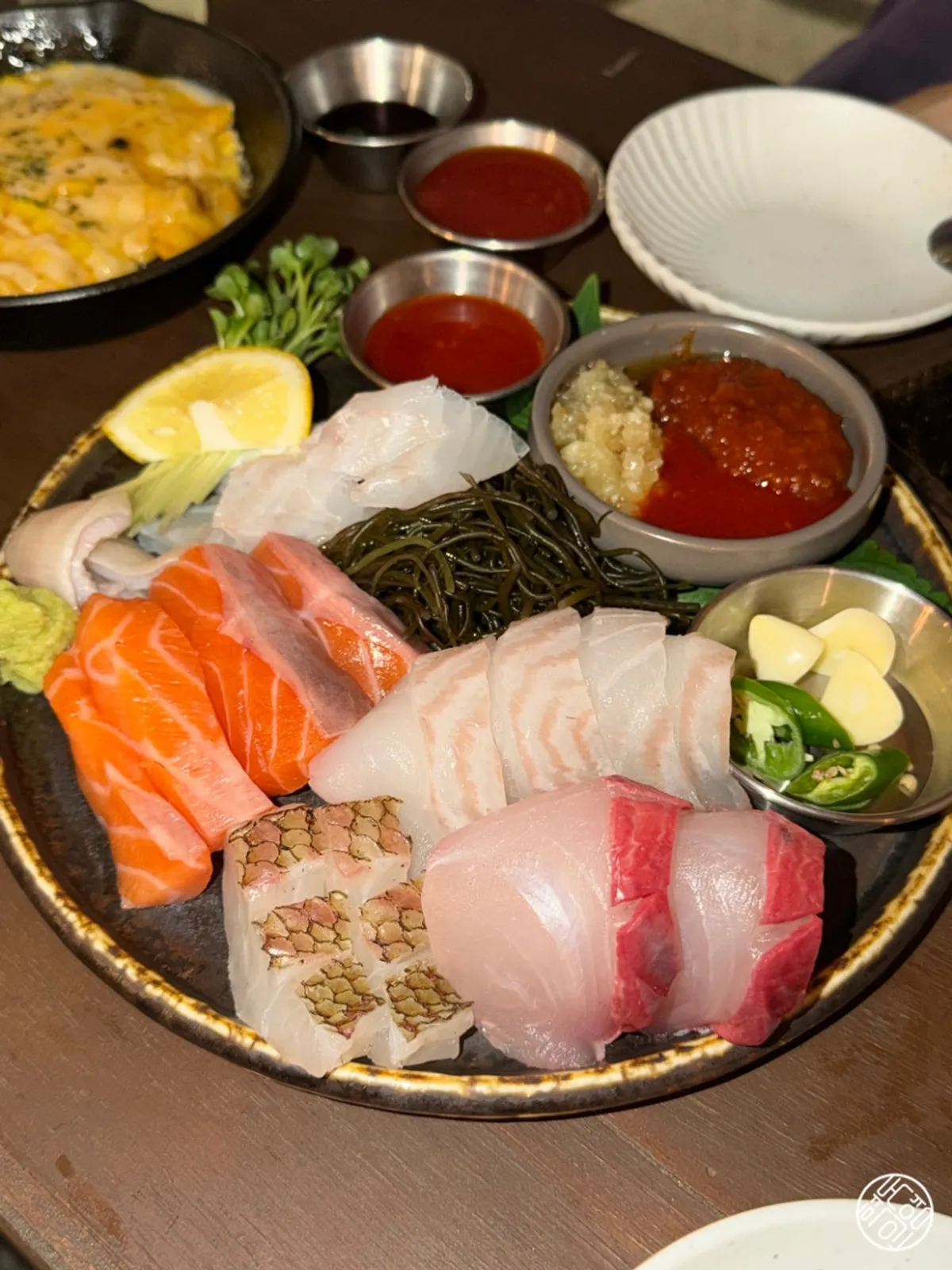 Assorted aged sashimi with salmon, flounder, and red seabream
