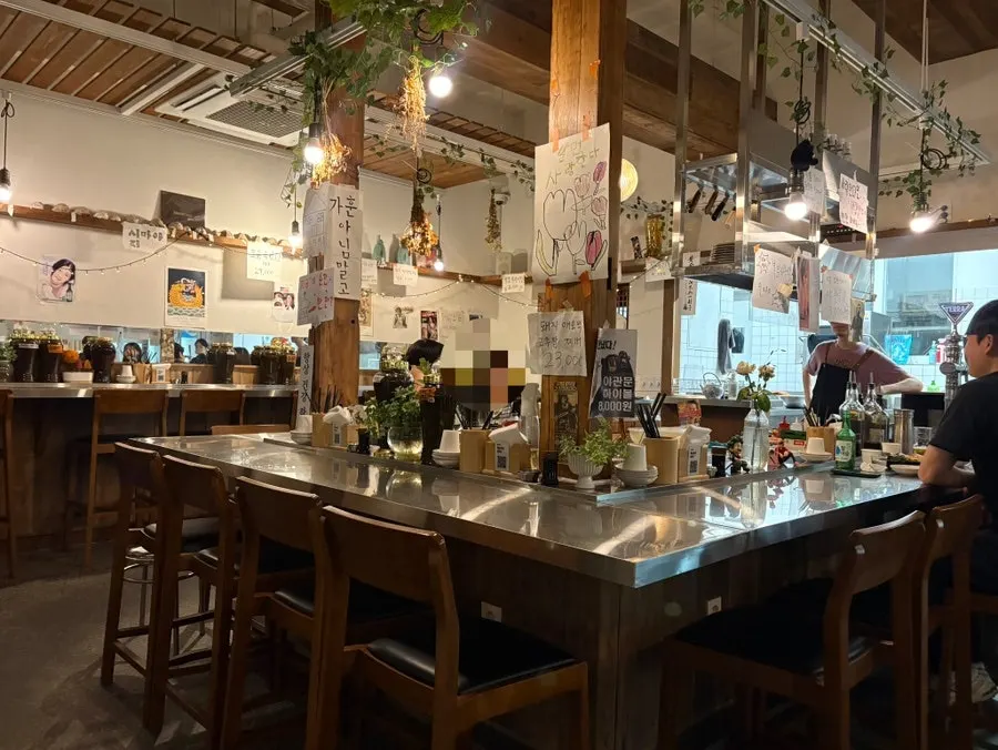 Interior of Daegang with tables and dachi bar seating