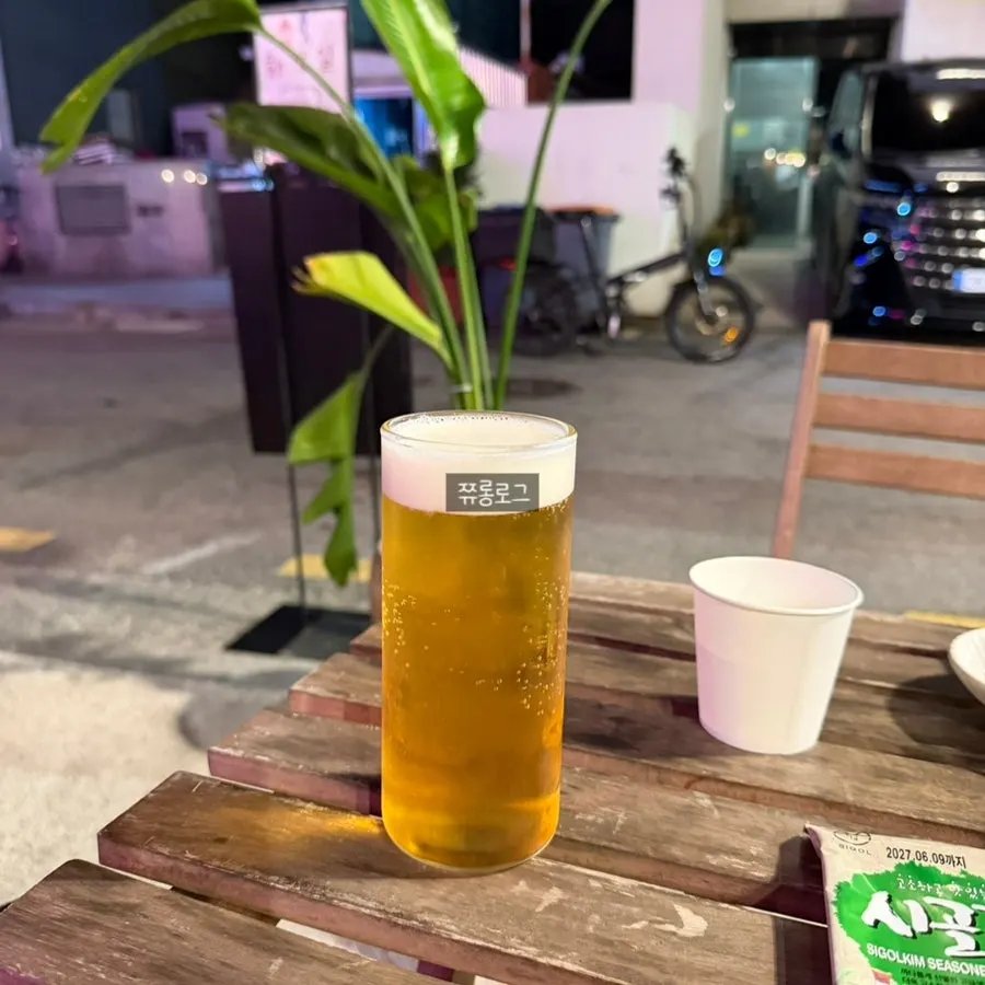 Draft beer on an outdoor table at Daegang