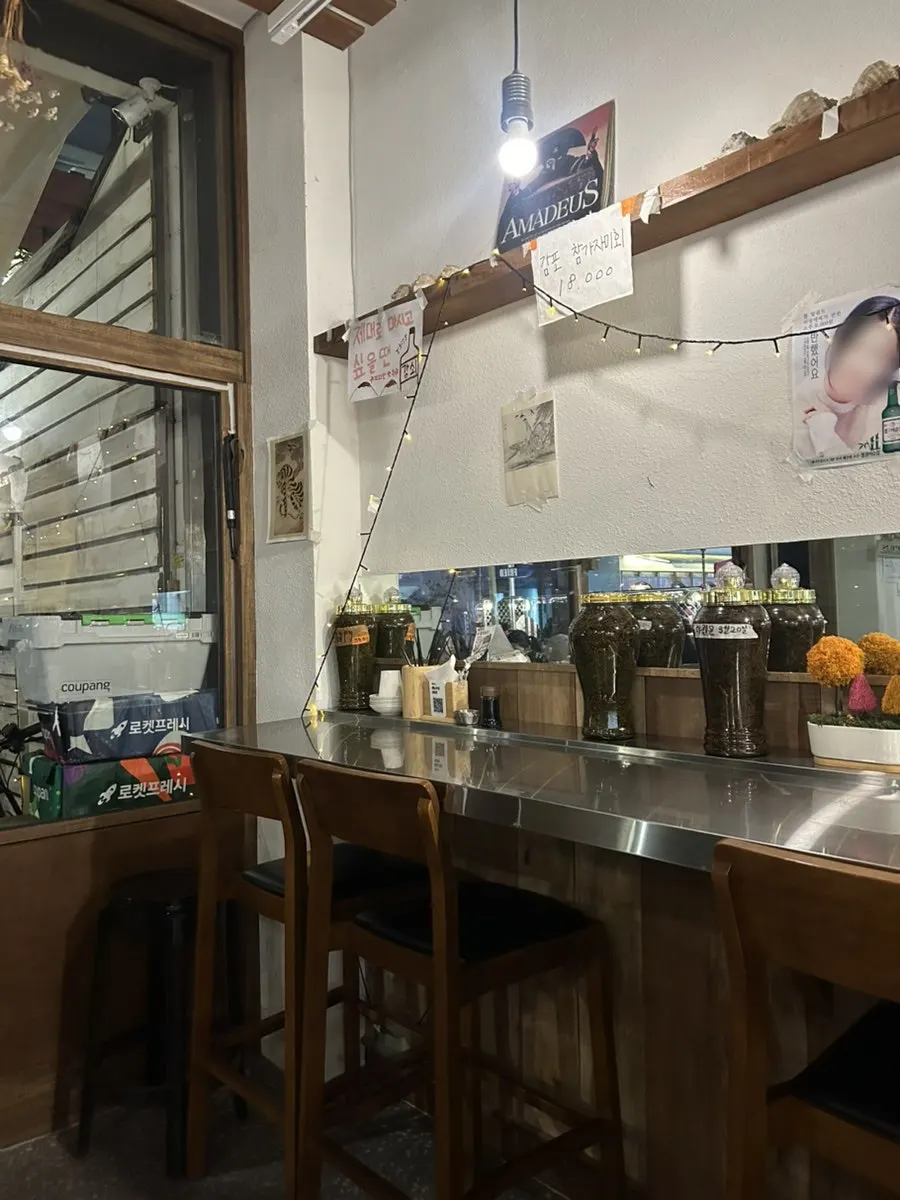 Bottles of homemade yagwanmun liquor on display at Daegang