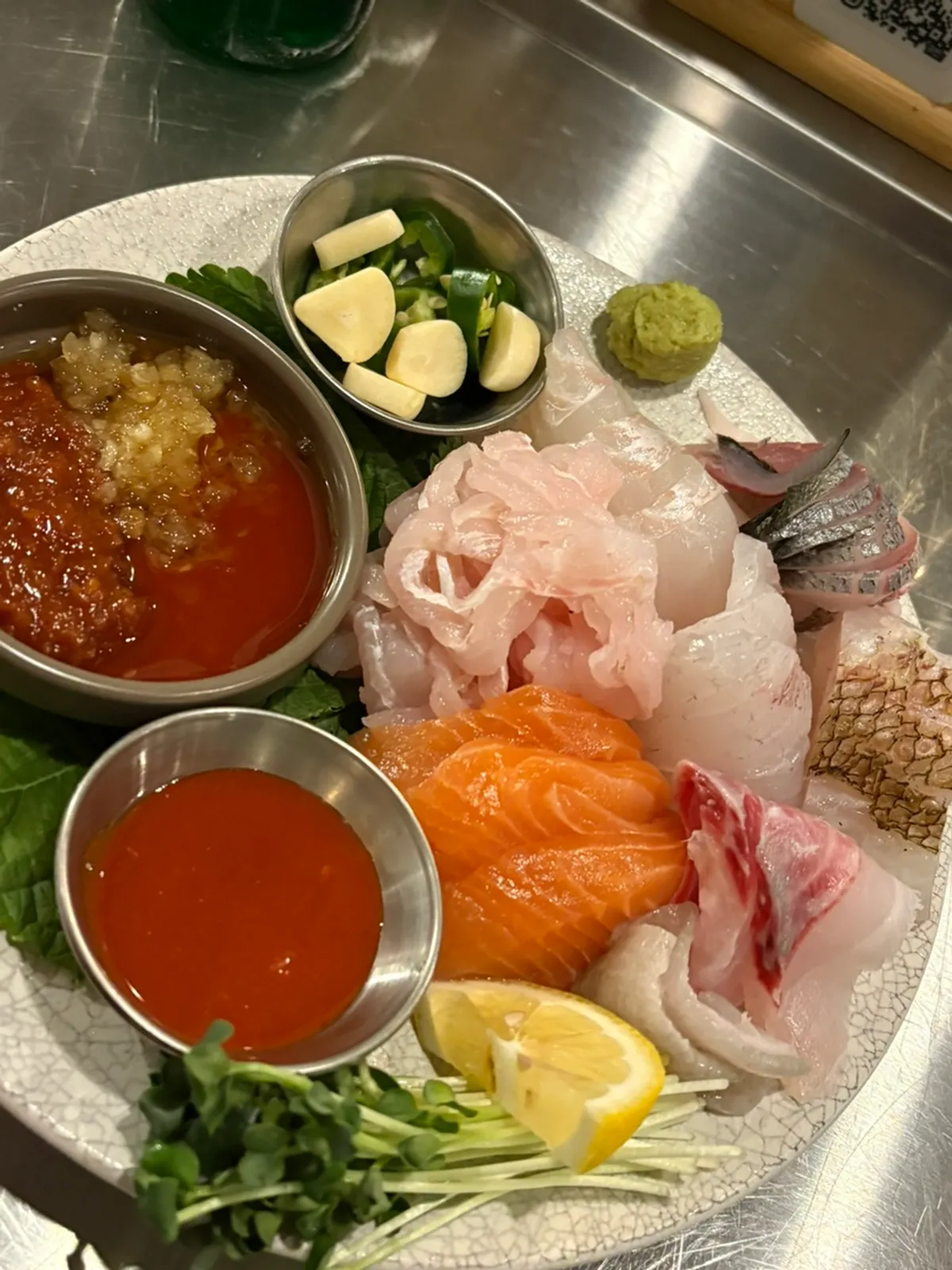 Aged sashimi served with soy sauce, ssamjang, and chojang