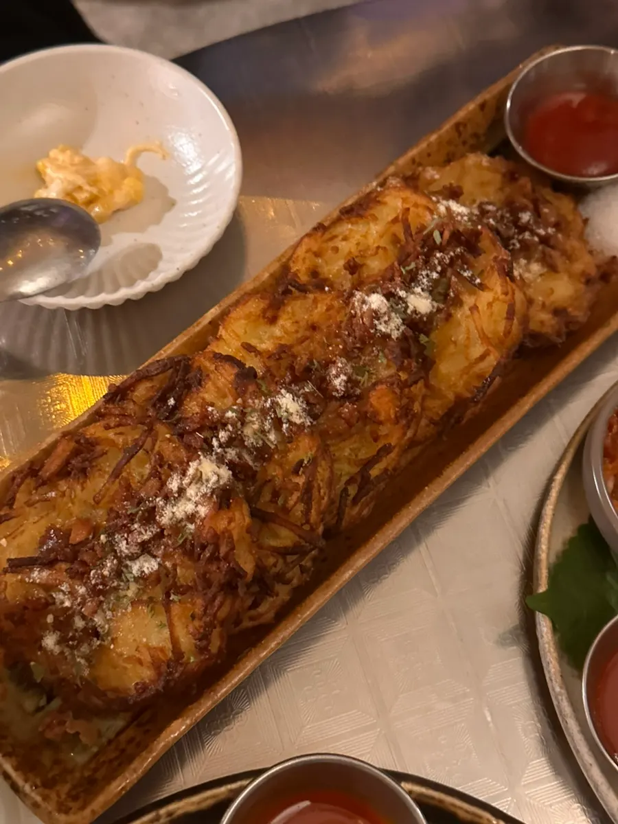Crispy potato pancake sprinkled with cheese powder