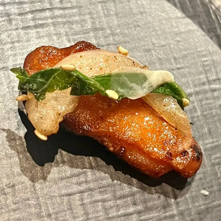 Salt-grilled makchang served with stir-fried vegetables