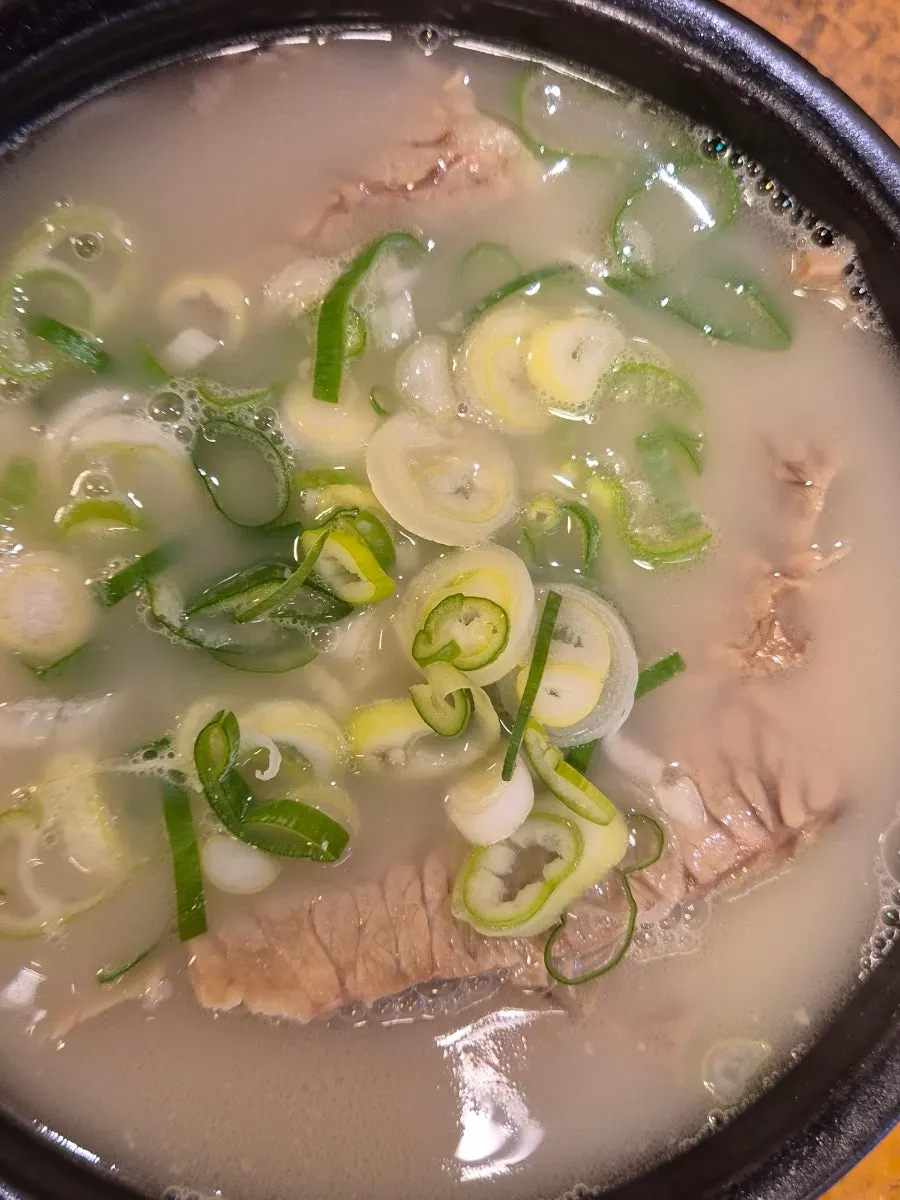 A spoonful of milky ox-bone broth