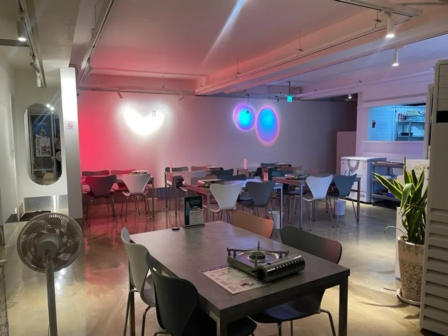Second-floor interior of With Gopchang with many tables