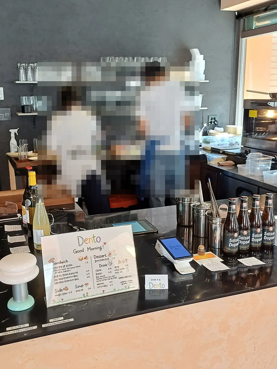 Dento interior with the owner making drinks