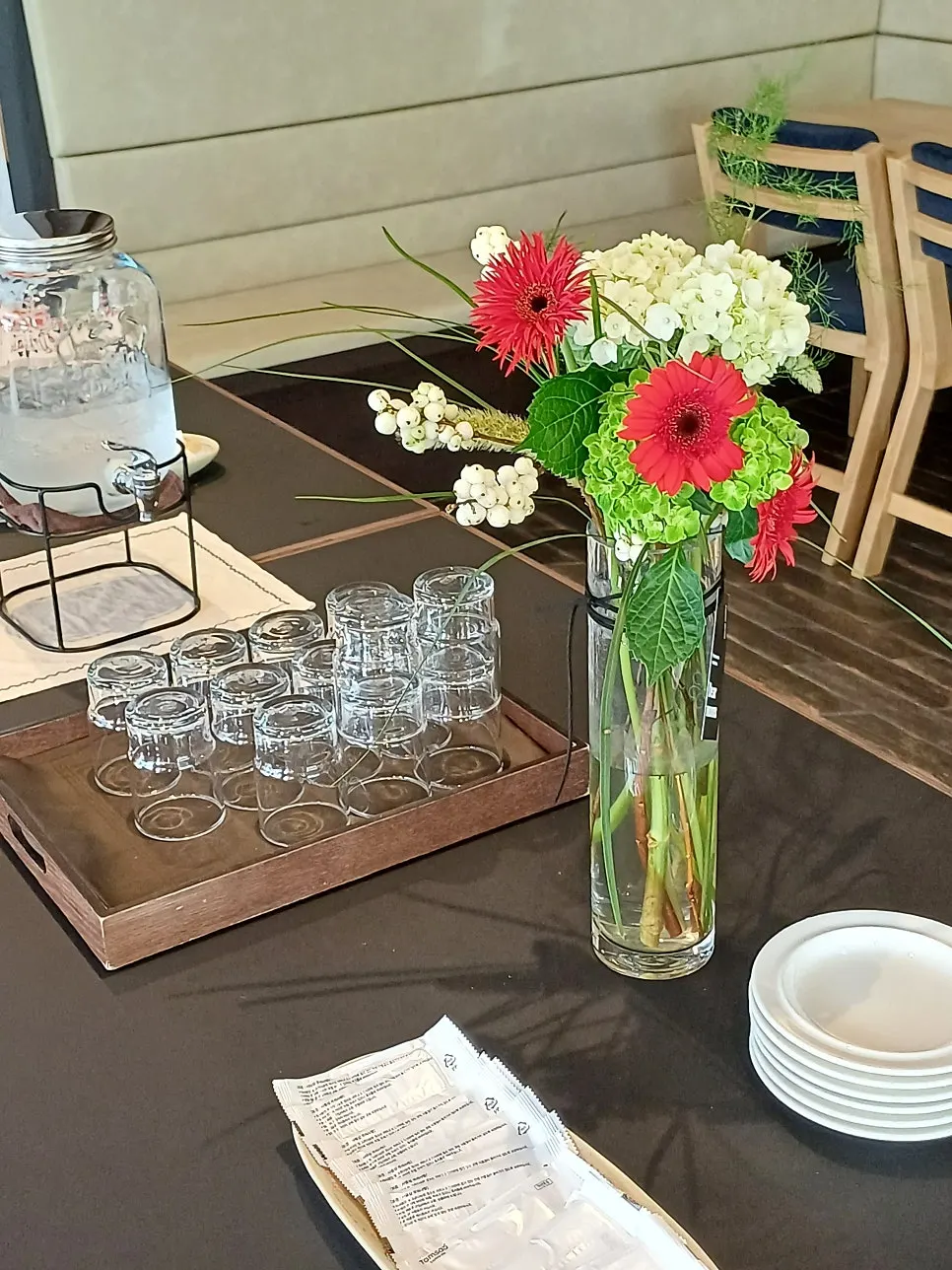Tableware and water on Dento's center table
