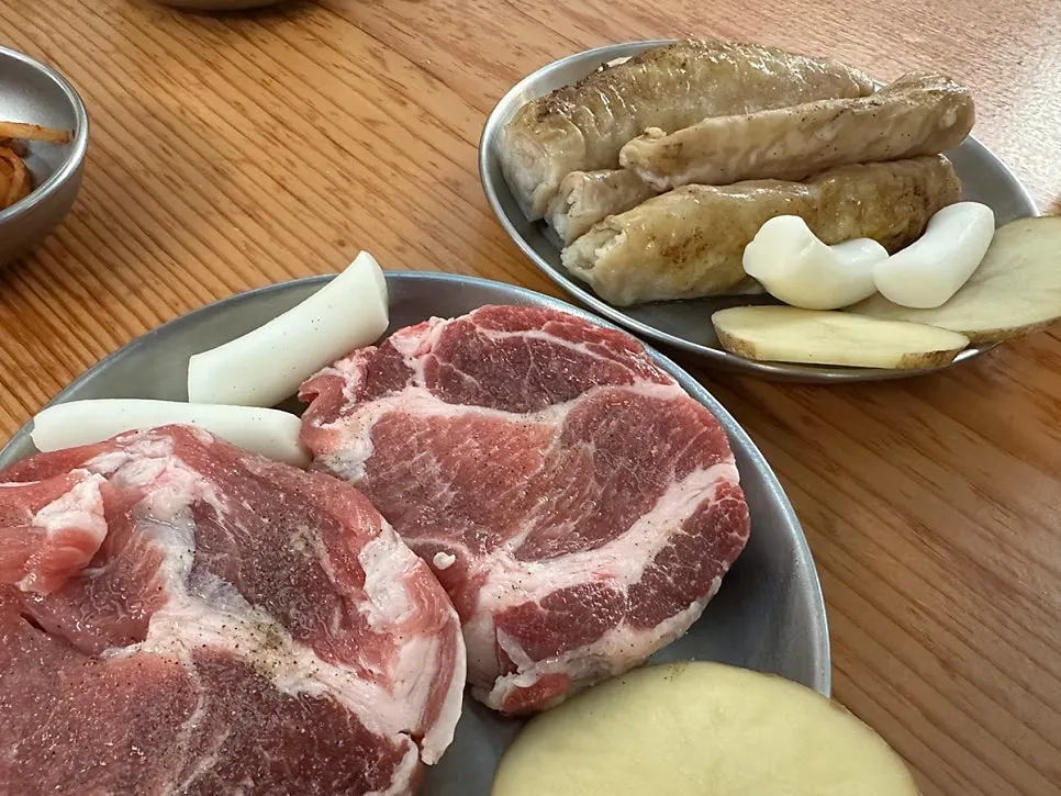 Iberico pork neck and makchang laid out on the table