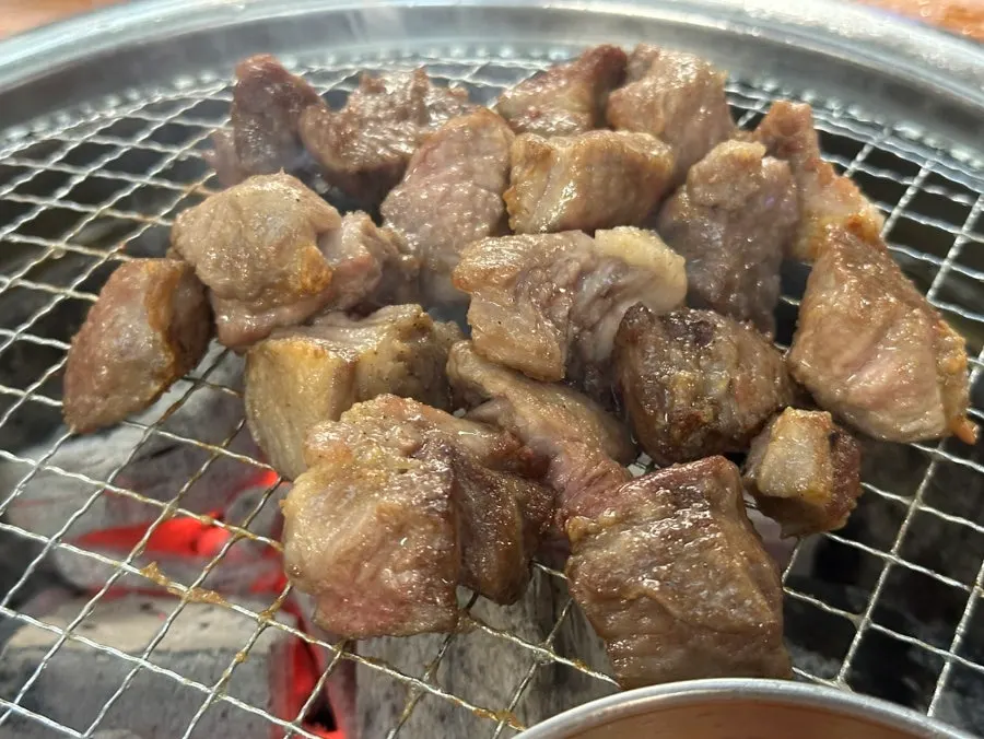 Iberico pork neck grilling on the swapped plate