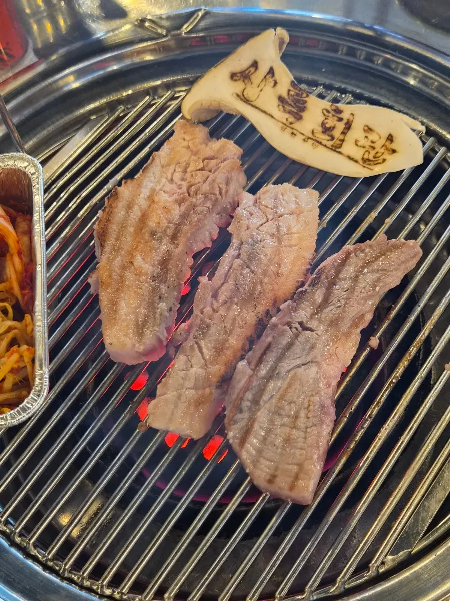 Samgyeopsal and mokssal on the charcoal grill