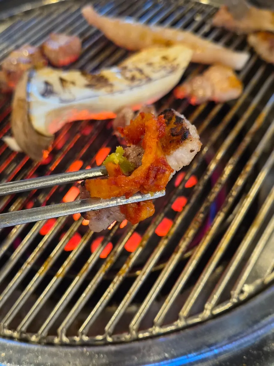Close-up of smoky-charred samgyeopsal