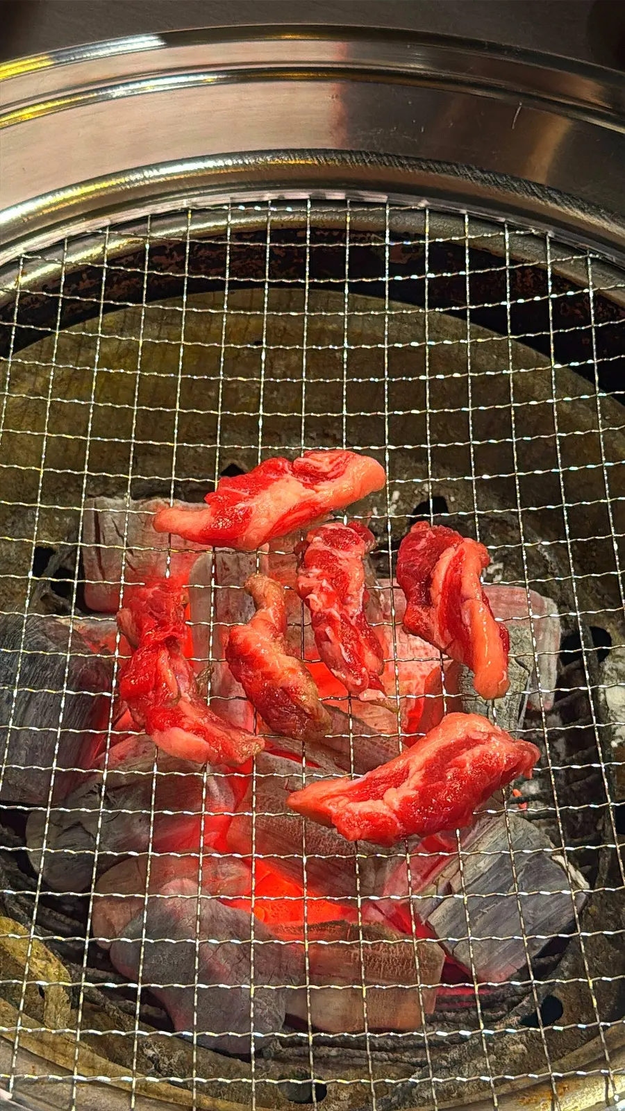 Fresh beef rib meat on a charcoal grill