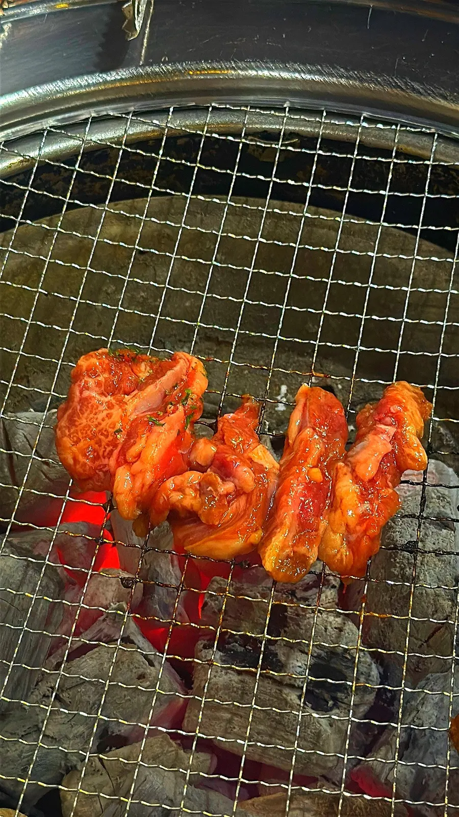 Marinated beef rib meat grilling over charcoal