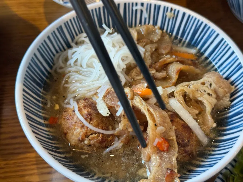Bún chả served with spring rolls